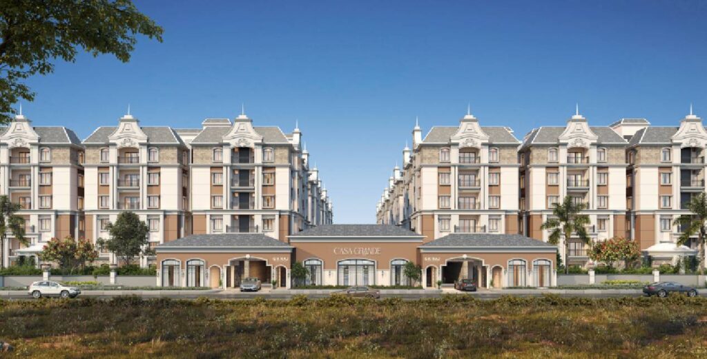 Front view of Casagrande entrance with elegant European-style architecture and symmetrical residential blocks